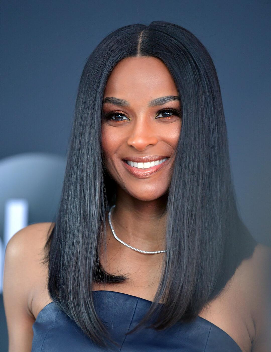 A photo of Ciara with a super long lob hairstyle wearing a white necklace Mobile