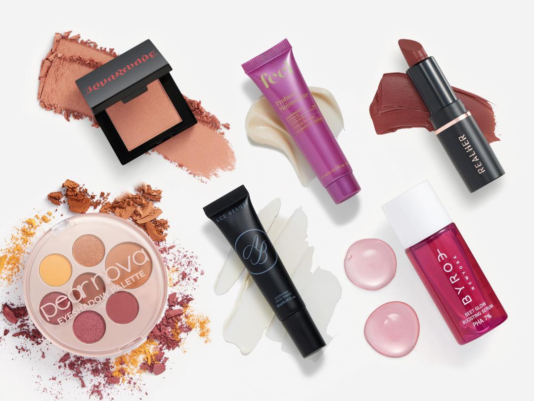 Makeup and skincare products from the February 2024 IPSY Glam Bag on white background Desktop