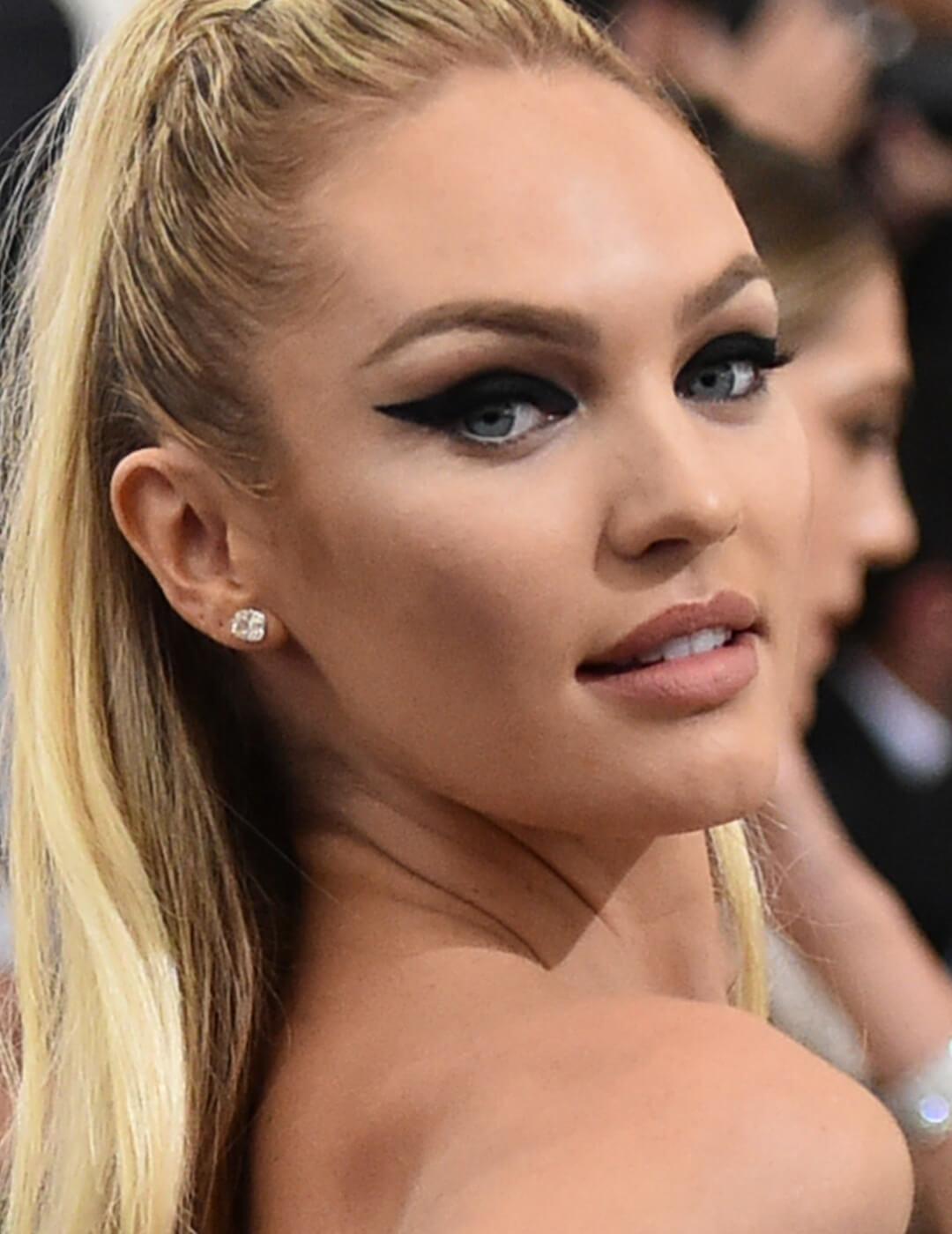 Candice Swanepoel rocking a bold winged eyeliner look Mobile