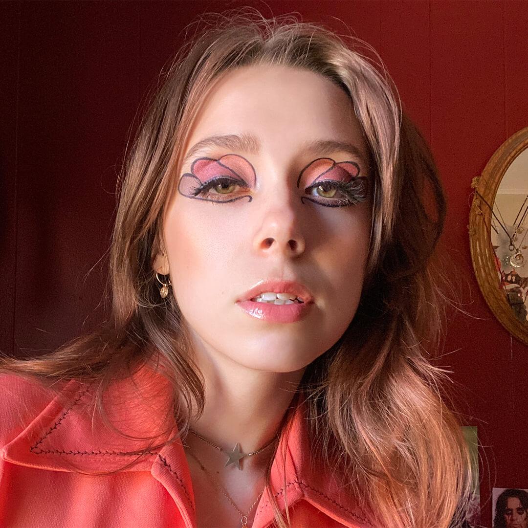 Close-up image of a model rocking a floral eyeshadow makeup look Mobile