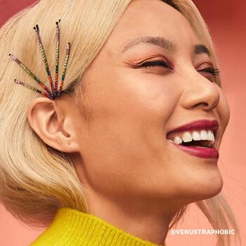 Catherine Pham wearing hair pins with colorful rhinestones smiles Mobile
